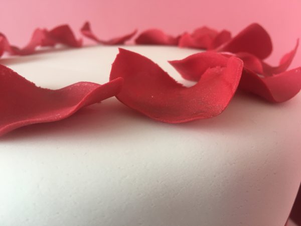 Christmas cake with petals close up